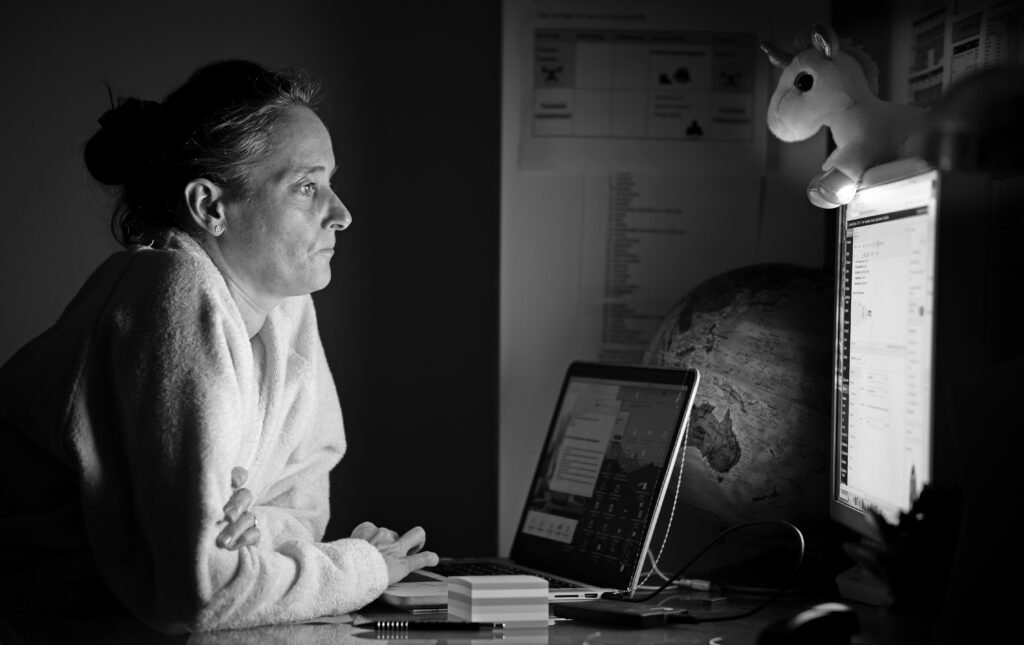 Rebecca Ramsay working late at night while building her ecommerce business. A real photograph from the early days of her entrepreneurial journey that later inspired Lean Ecommerce.